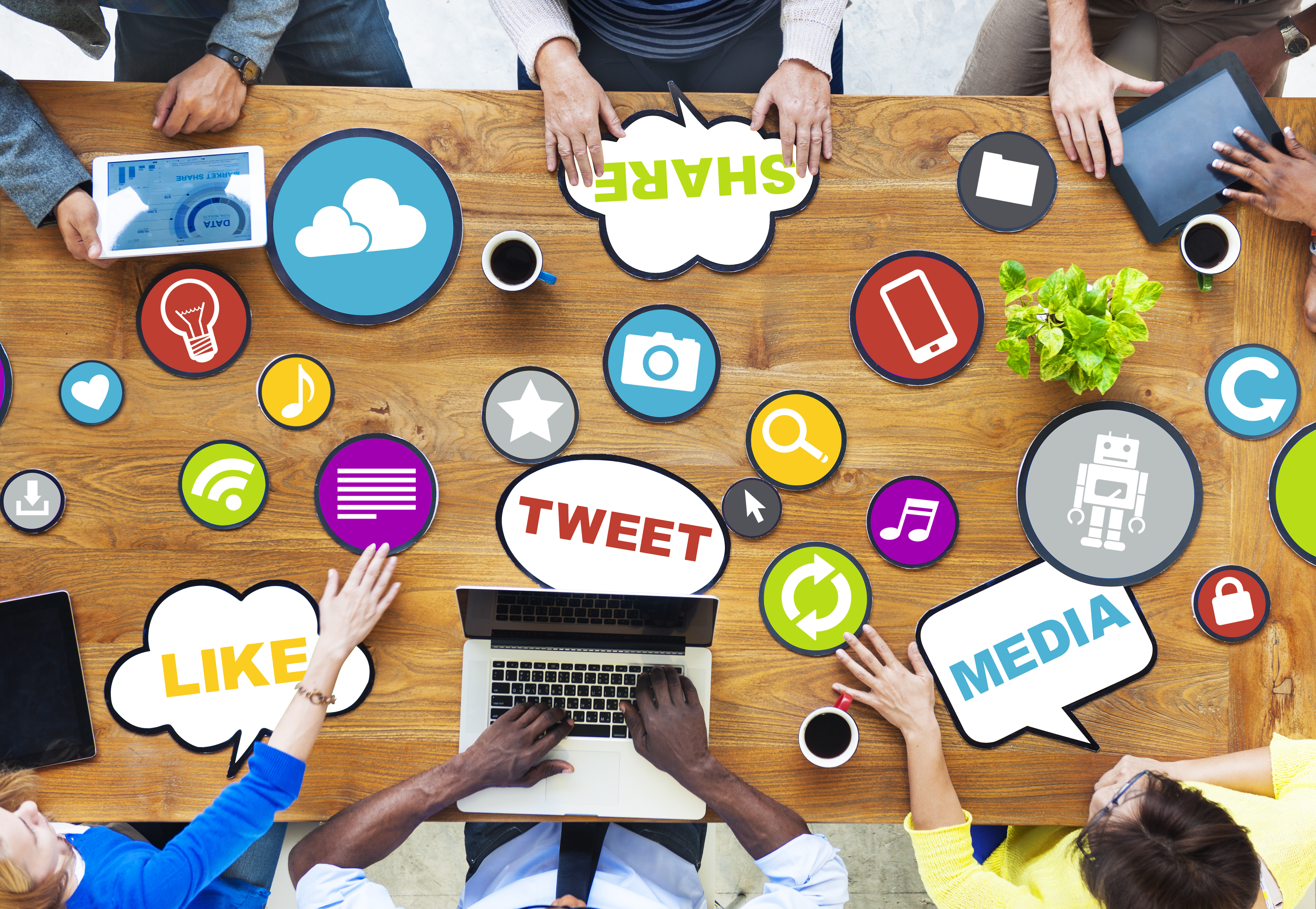 Six people in a meeting to discuss social media marketing